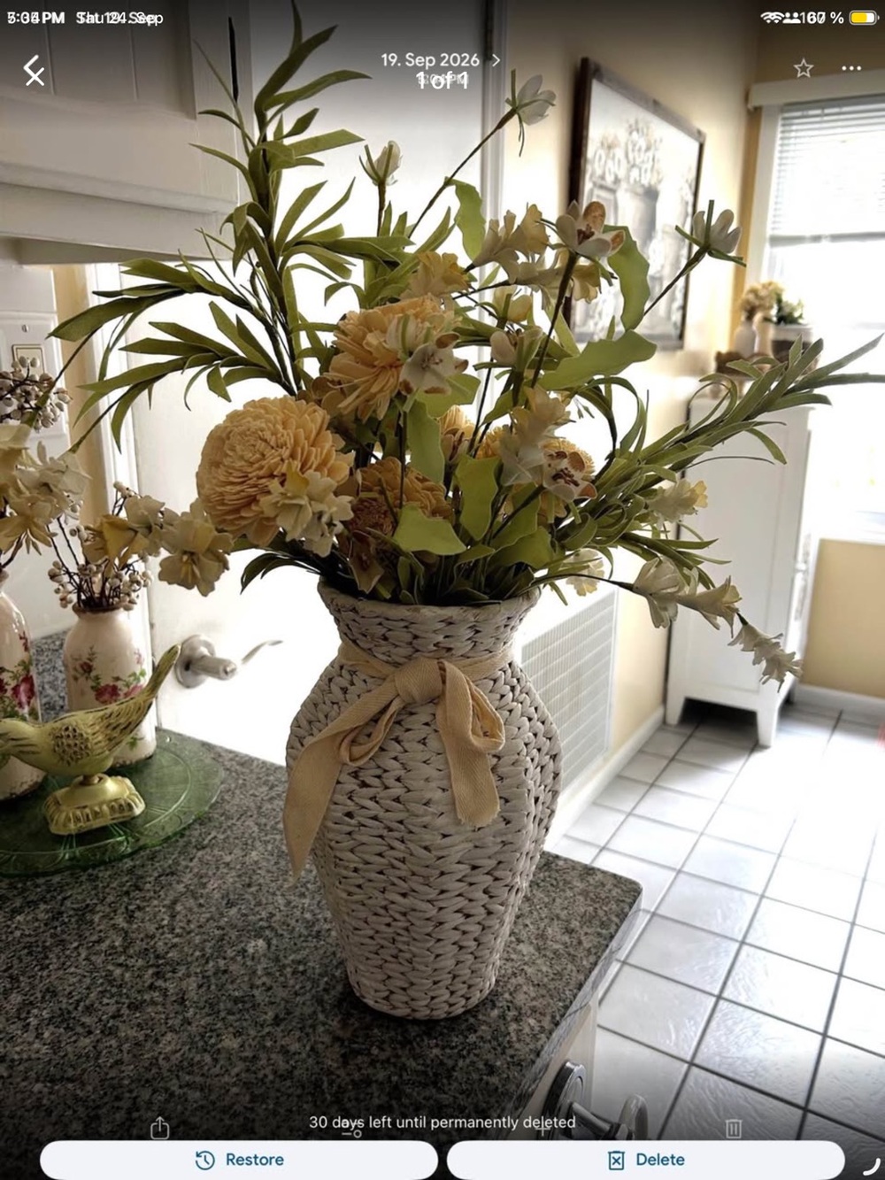 Woven Cream Decorative Vase with cream Ribbon and Faux Floral Arrangement. 12”H